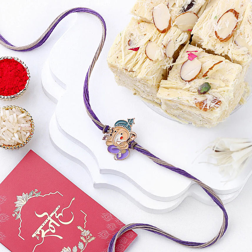 Bal Ganesha Cheerful Charm Rakhi N Soan Papdi