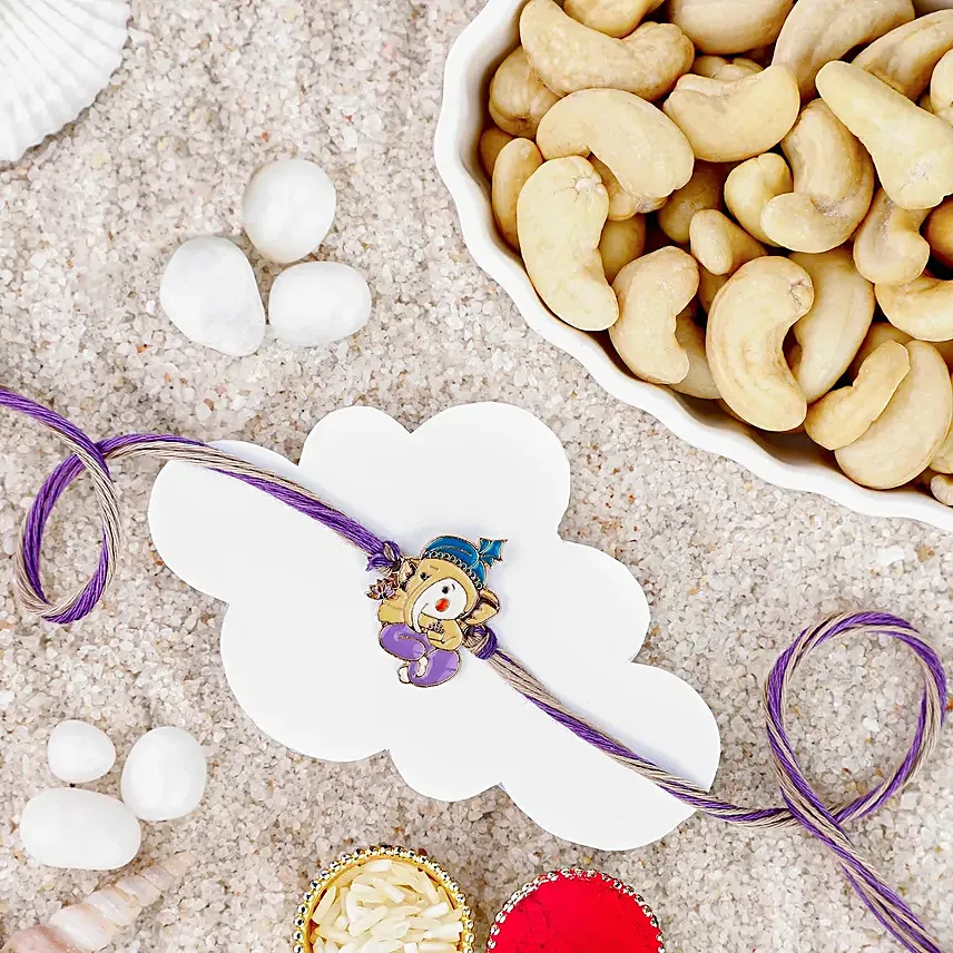 Bal Ganesha Cheerful Charm Rakhi N Roasted Cashews Gift Set