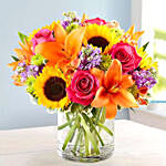 Bright Vivid Bunch Of Flowers In Glass Vase