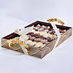 Assorted Dates Tray With Beautiful Flowers