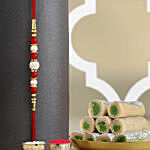 Luminescent Luster Pearl Rakhi N Kaju Roll